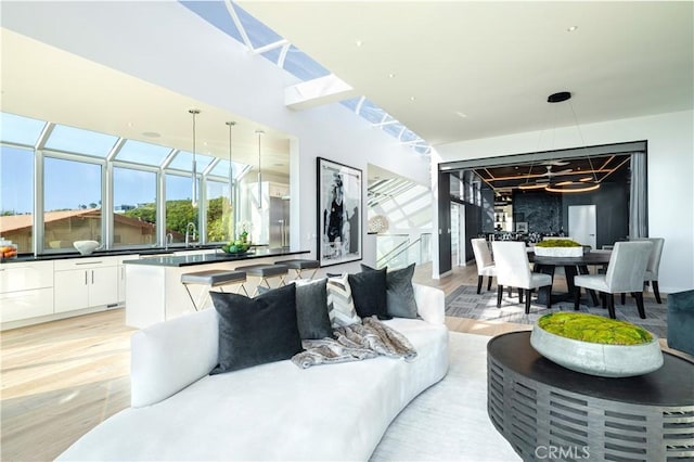 2522 The Strand, Manhattan Beach, CA 90266 - living area featuring light wood-style flooring and healthy amount of natural light