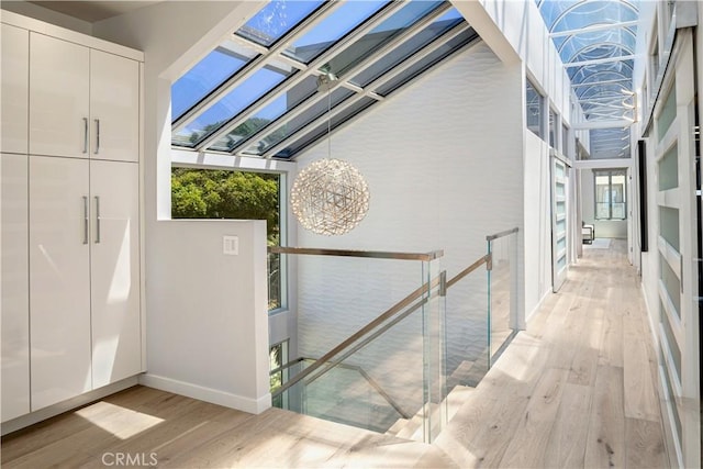 2522 The Strand, Manhattan Beach, CA 90266 - interior space with wood finished floors, plenty of natural light, baseboards, and a chandelier