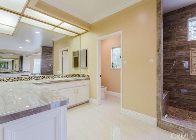 18853 Beechtree Ln, Porter Ranch, CA 91326 - bathroom with tiled shower, vanity, toilet, crown molding, and baseboards