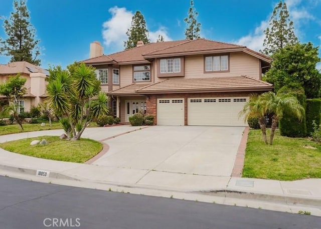 18853 Beechtree Ln, Porter Ranch, CA 91326 - view of front facade featuring an attached garage, concrete driveway, a chimney, and a front lawn