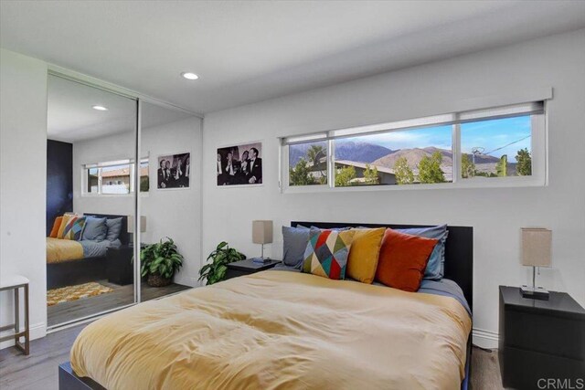 360 W Bon Air Dr, Palm Springs, CA 92262 - bedroom with recessed lighting, baseboards, a closet, and wood finished floors