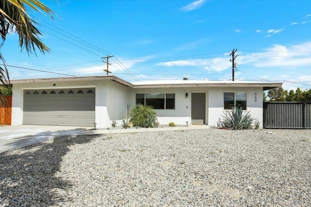 360 W Bon Air Dr, Palm Springs, CA 92262 - ranch-style house featuring a garage, stucco siding, and concrete driveway