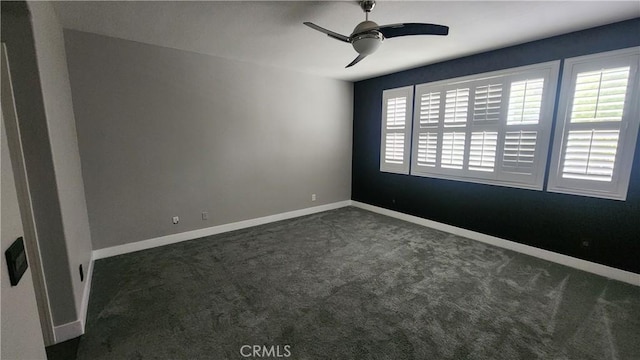 26246 Reade Pl, Stevenson Ranch, CA 91381 - unfurnished room featuring dark colored carpet, a ceiling fan, and baseboards