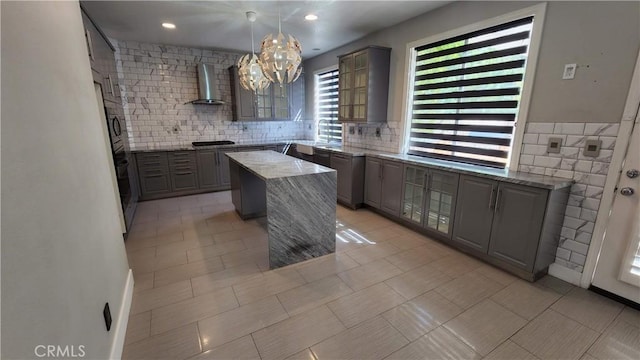 26246 Reade Pl, Stevenson Ranch, CA 91381 - kitchen featuring wall chimney exhaust hood, gray cabinetry, and a chandelier