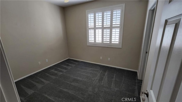 26246 Reade Pl, Stevenson Ranch, CA 91381 - unfurnished bedroom featuring dark colored carpet and baseboards