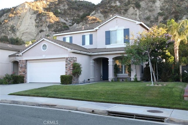 26246 Reade Pl, Stevenson Ranch, CA 91381 - traditional home with stucco siding, a mountain view, a garage, and concrete driveway