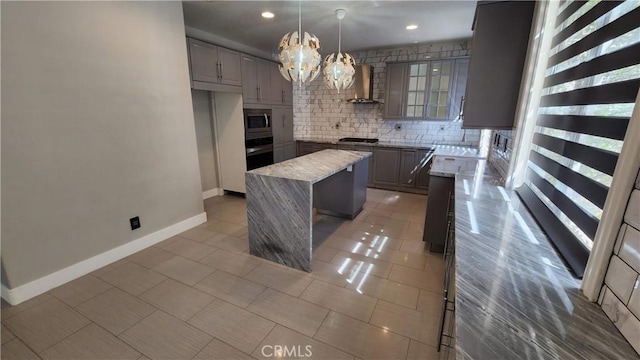 26246 Reade Pl, Stevenson Ranch, CA 91381 - kitchen featuring wall oven, wall chimney exhaust hood, stainless steel microwave, a center island, and gas stovetop