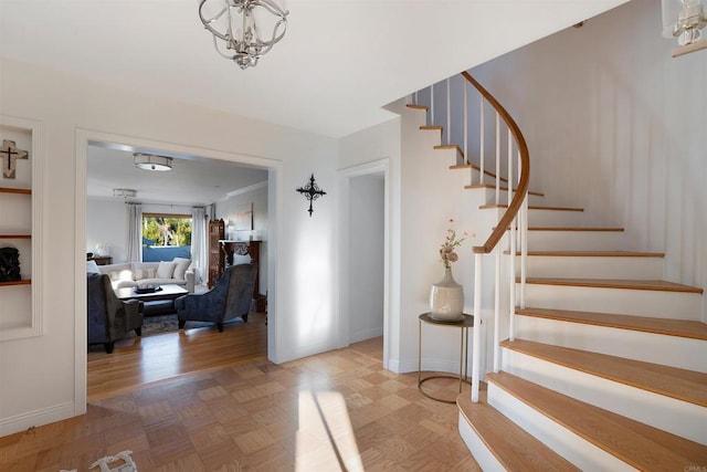 2675 Clove St, San Diego, CA 92106 - stairs with a chandelier and parquet flooring