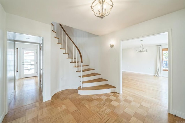 2675 Clove St, San Diego, CA 92106 - staircase featuring a chandelier and baseboards