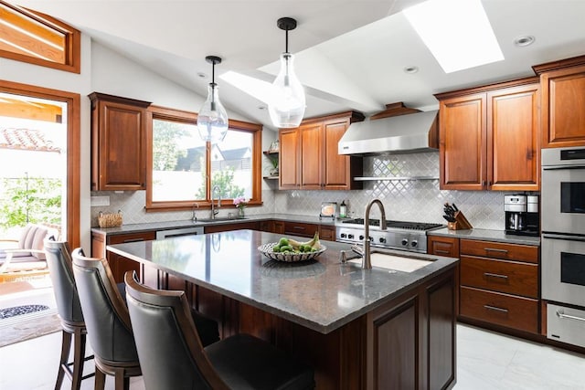 2675 Clove St, San Diego, CA 92106 - kitchen with wall chimney exhaust hood, a skylight, stainless steel appliances, lofted ceiling, and a warming drawer