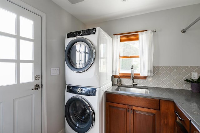 2675 Clove St, San Diego, CA 92106 - laundry room with stacked washing machine and dryer and cabinet space