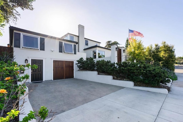 2675 Clove St, San Diego, CA 92106 - modern home featuring a garage, stucco siding, and driveway