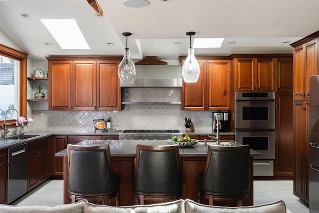 2675 Clove St, San Diego, CA 92106 - kitchen featuring a skylight, appliances with stainless steel finishes, a breakfast bar area, open shelves, and recessed lighting