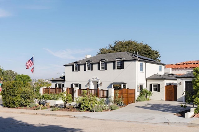 2675 Clove St, San Diego, CA 92106 - view of front of property featuring roof mounted solar panels, stucco siding, and a chimney