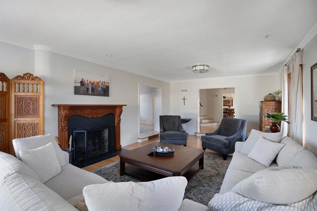 2675 Clove St, San Diego, CA 92106 - living area featuring wood finished floors, ornamental molding, a fireplace with flush hearth, and stairway