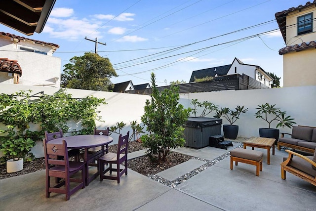 2675 Clove St, San Diego, CA 92106 - fenced backyard featuring a hot tub, a patio, and outdoor dining space