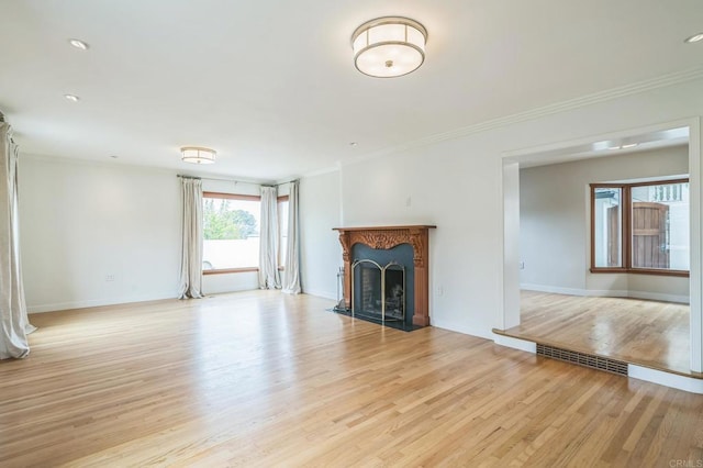 2675 Clove St, San Diego, CA 92106 - unfurnished living room with crown molding, light wood-style flooring, and a fireplace with flush hearth