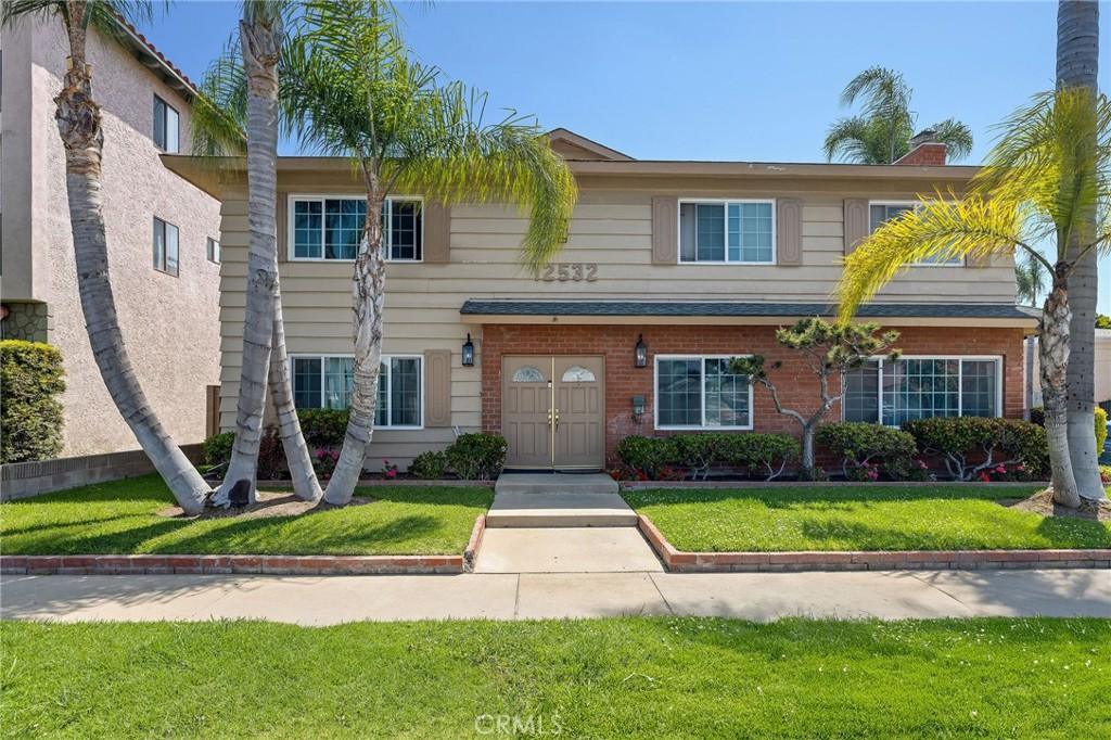 12532 Cranbrook Ave, Hawthorne, CA 90250 - multi unit property featuring a front lawn and brick siding