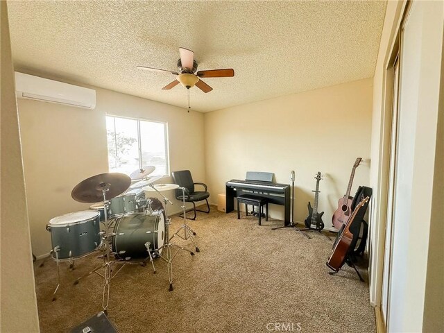 5374 Morongo Rd Unit 29, Palms, CA 92277 - office area with a wall mounted air conditioner, a ceiling fan, carpet, and a textured ceiling