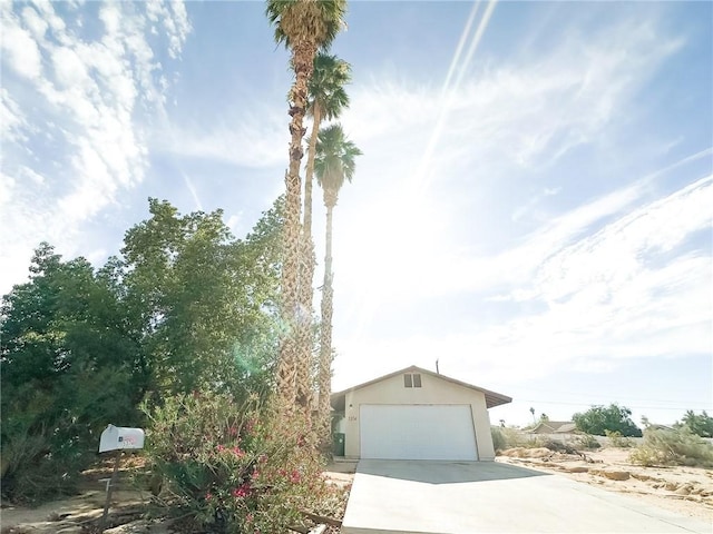 5374 Morongo Rd Unit 29, Palms, CA 92277 - view of front facade featuring driveway and stucco siding