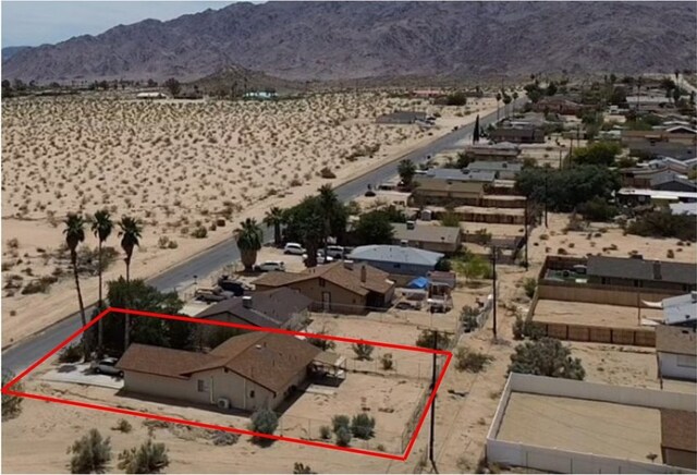 5374 Morongo Rd Unit 29, Palms, CA 92277 - aerial overview of property's location with property parcel outlined, mountains, and a desert landscape
