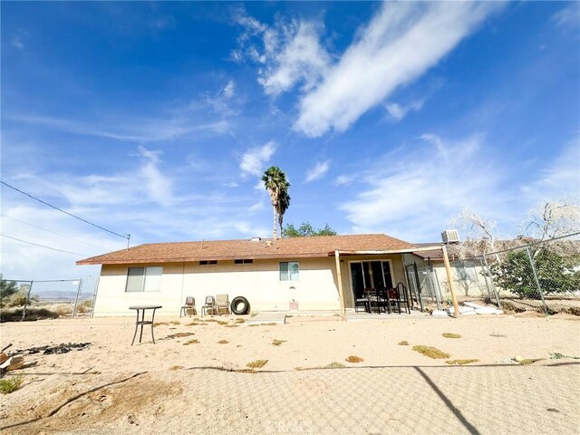 5374 Morongo Rd Unit 29, Palms, CA 92277 - rear view of property featuring a patio