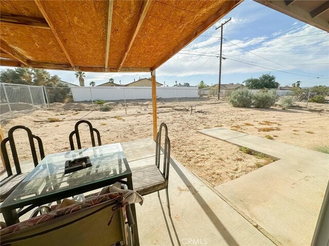 5374 Morongo Rd Unit 29, Palms, CA 92277 - fenced backyard with a patio