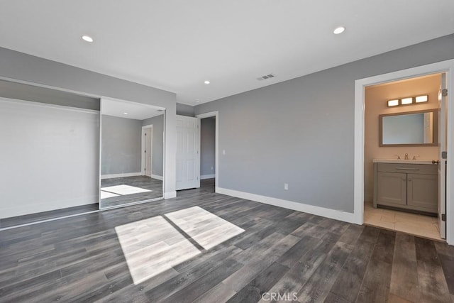 7719 Nestle Ave, Reseda, CA 91335 - unfurnished bedroom featuring dark wood finished floors, baseboards, recessed lighting, a closet, and ensuite bath
