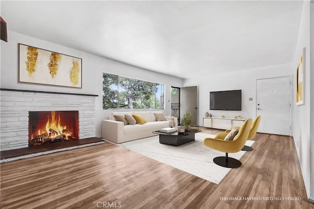 305 Raymondale Dr Unit L, South Pasadena, CA 91030 - living room featuring wood finished floors and a warm lit fireplace