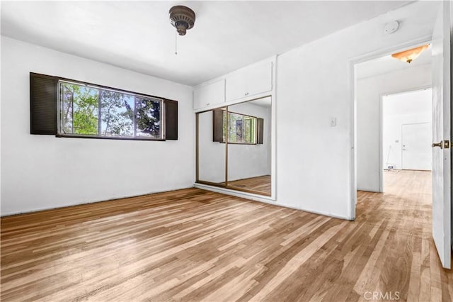 305 Raymondale Dr Unit L, South Pasadena, CA 91030 - unfurnished bedroom with light wood finished floors, a closet, and ceiling fan