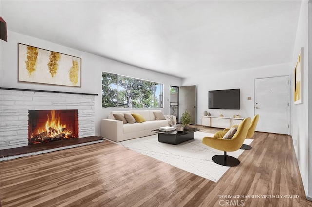 305 Raymondale Dr Unit L, South Pasadena, CA 91030 - living area with wood finished floors and a warm lit fireplace