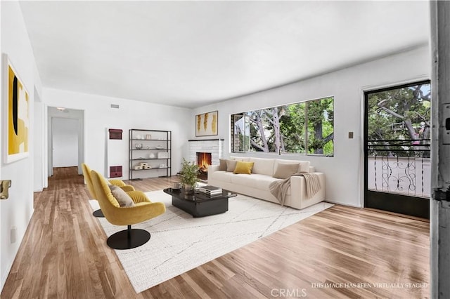 305 Raymondale Dr Unit L, South Pasadena, CA 91030 - living room featuring wood finished floors and a brick fireplace