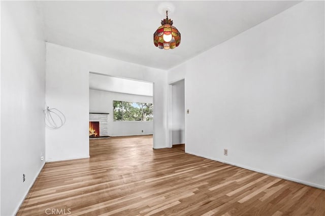 305 Raymondale Dr Unit L, South Pasadena, CA 91030 - spare room featuring wood finished floors and a brick fireplace