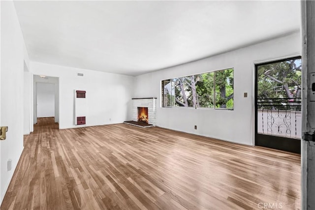 305 Raymondale Dr Unit L, South Pasadena, CA 91030 - unfurnished living room with wood finished floors and a fireplace