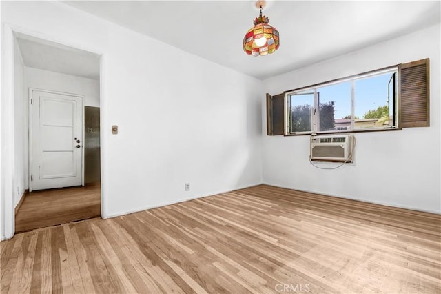 305 Raymondale Dr Unit L, South Pasadena, CA 91030 - empty room featuring an AC wall unit and light wood finished floors