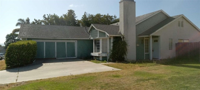 175 Wilson Dr, Santa Maria, CA 93455 - view of front of house with a chimney, a front yard, and concrete driveway