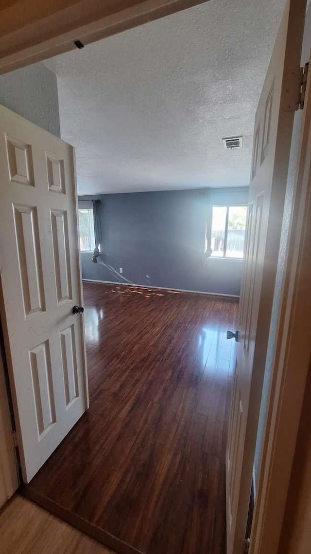 175 Wilson Dr, Santa Maria, CA 93455 - spare room featuring wood finished floors, a textured ceiling, and baseboards