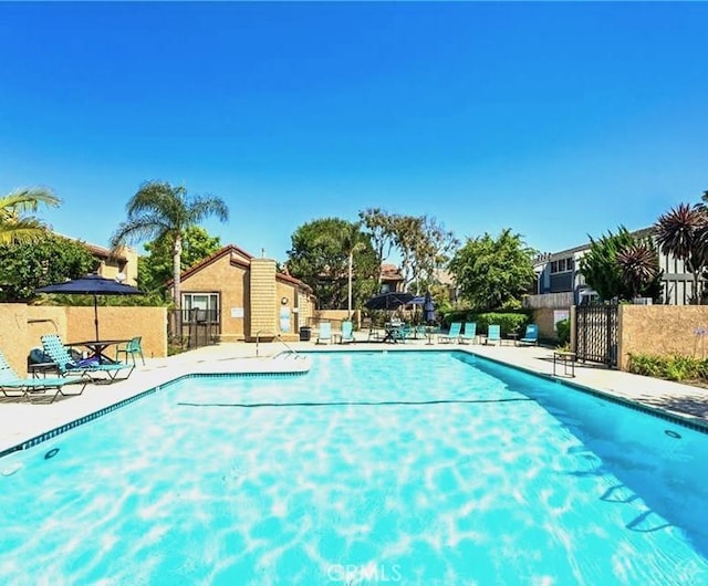 16879 Bluewater Ln Unit 25, Huntington Beach, CA 92649 - community pool featuring a patio
