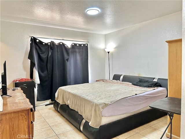 25079 Camino Del Norte, Barstow, CA 92311 - bedroom with light tile patterned floors, a textured ceiling, and a textured wall