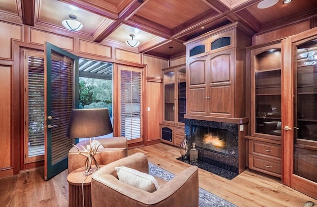 4843 La Jacaranda, Rancho Santa Fe, CA 92067 - living area featuring wood ceiling with exposed beams, a high end fireplace, ornamental molding, light wood-style floors, and coffered ceiling