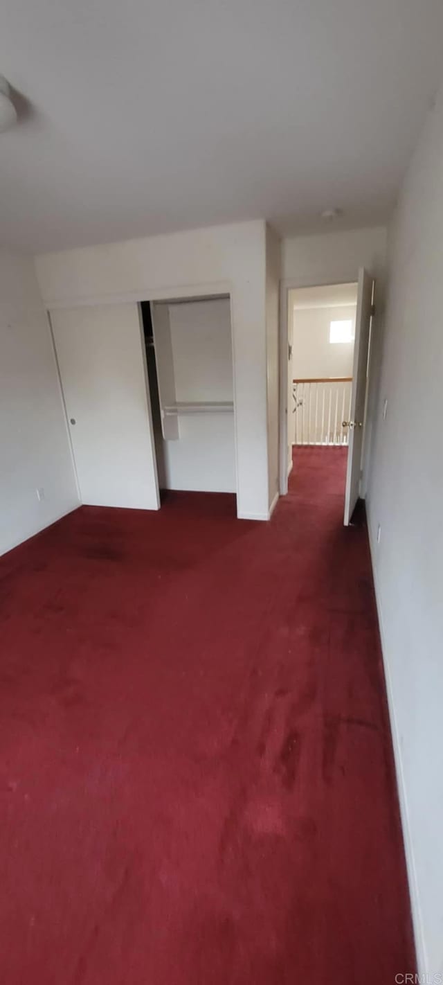 414 Ella Ln, San Diego, CA 92114 - corridor with baseboards and dark carpet