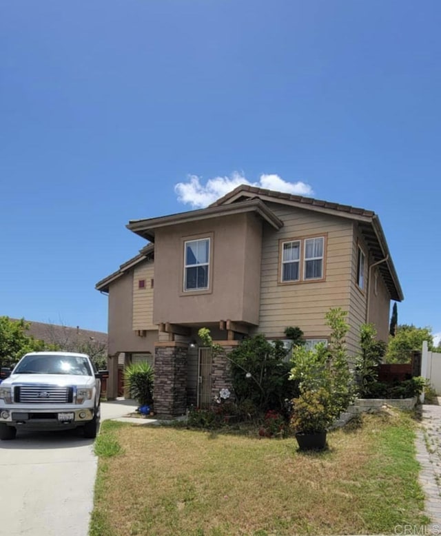 414 Ella Ln, San Diego, CA 92114 - view of front facade with stucco siding and driveway