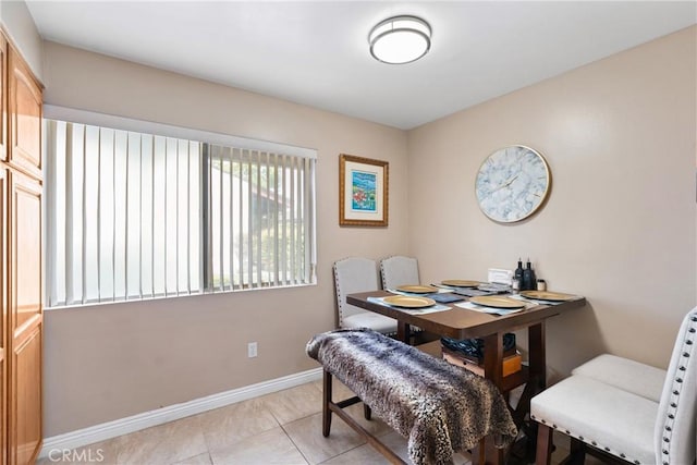 2011 W Katella Ave Unit 17, Anaheim, CA 92804 - dining area featuring baseboards and light tile patterned flooring