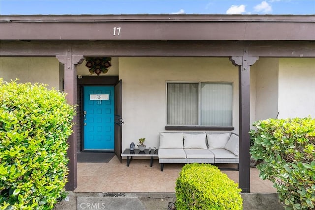 2011 W Katella Ave Unit 17, Anaheim, CA 92804 - property entrance with stucco siding and outdoor lounge area