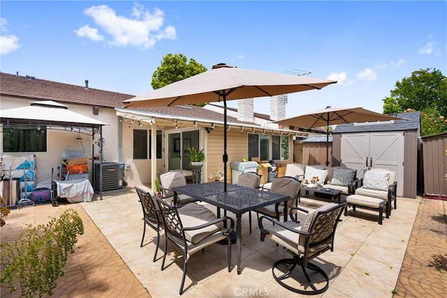 2011 W Katella Ave Unit 17, Anaheim, CA 92804 - view of patio / terrace featuring an outdoor living space, central AC unit, a gazebo, and outdoor dining space