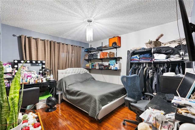 2011 W Katella Ave Unit 17, Anaheim, CA 92804 - bedroom with wood finished floors and a textured ceiling