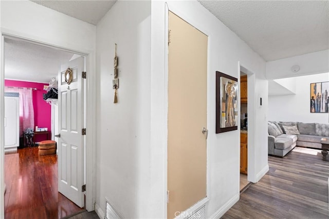 2011 W Katella Ave Unit 17, Anaheim, CA 92804 - hallway featuring wood finished floors and a textured ceiling