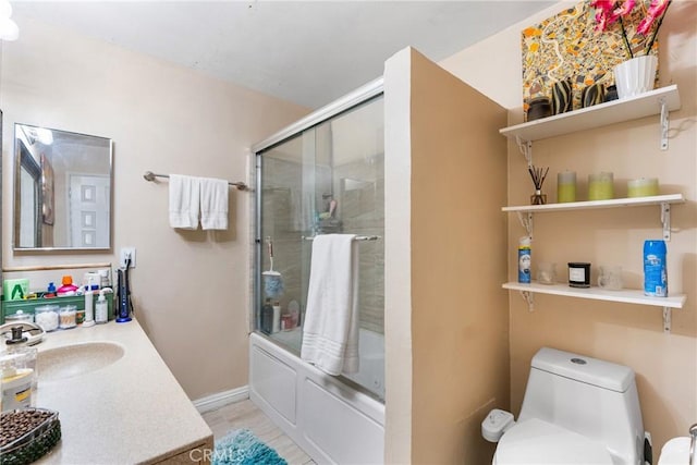 2011 W Katella Ave Unit 17, Anaheim, CA 92804 - full bathroom featuring vanity, shower / bath combination with glass door, and toilet