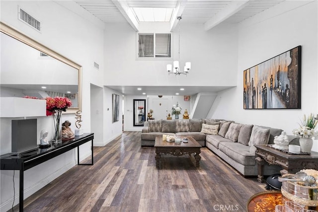 2011 W Katella Ave Unit 17, Anaheim, CA 92804 - living room featuring wood finished floors, a towering ceiling, beam ceiling, a chandelier, and baseboards