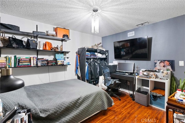 2011 W Katella Ave Unit 17, Anaheim, CA 92804 - bedroom with wood finished floors and a textured ceiling